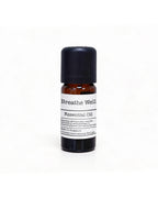 100 percent pure herbal respire shield essential oil 10ml amber bottle with minimalist white label on fresh white slate texture